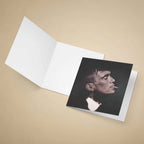 Greeting card of Thomas Shelby smoking a cigarette on a beige background.
